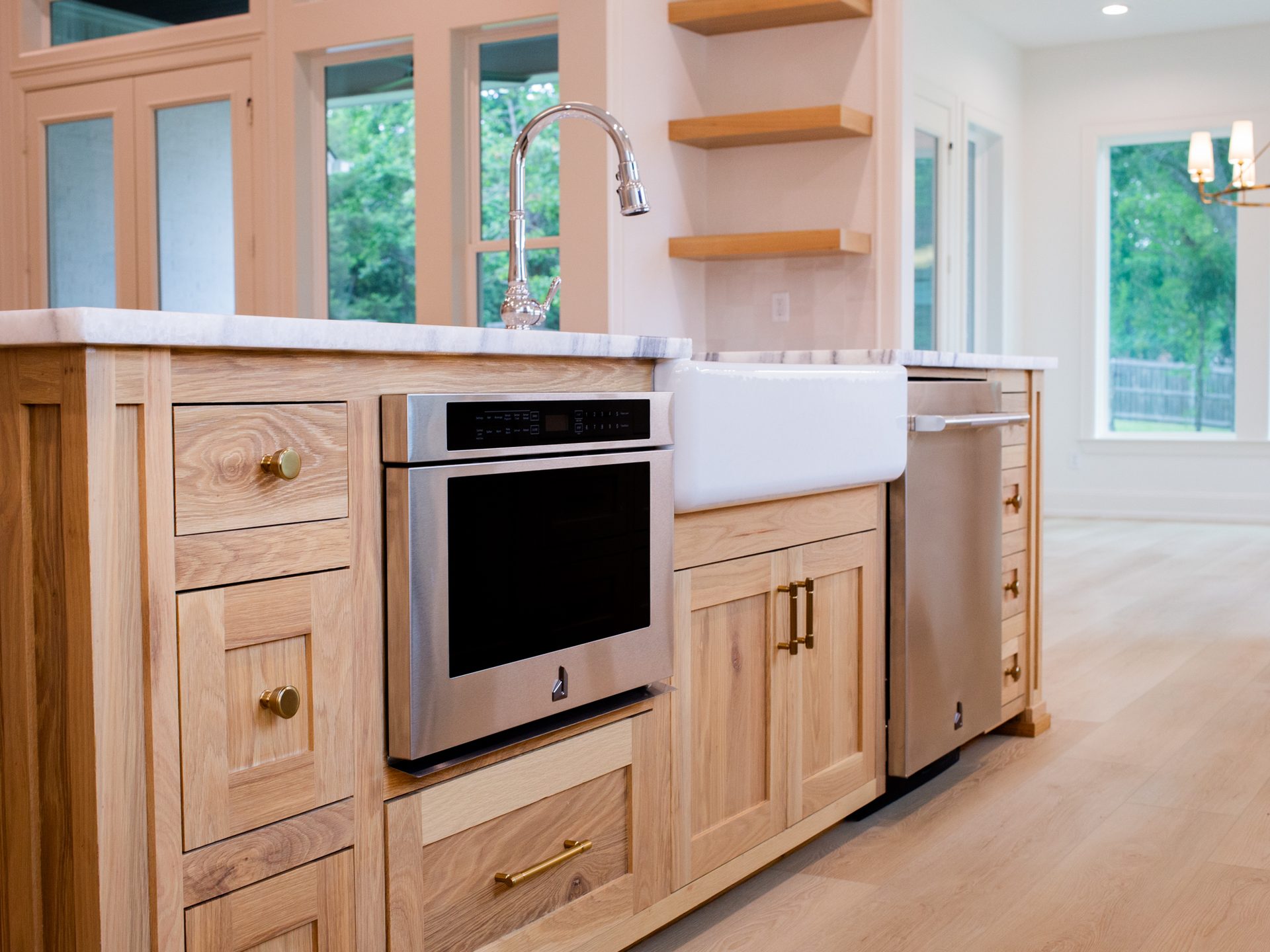 Kitchen island detail with white marble waterfall edge.